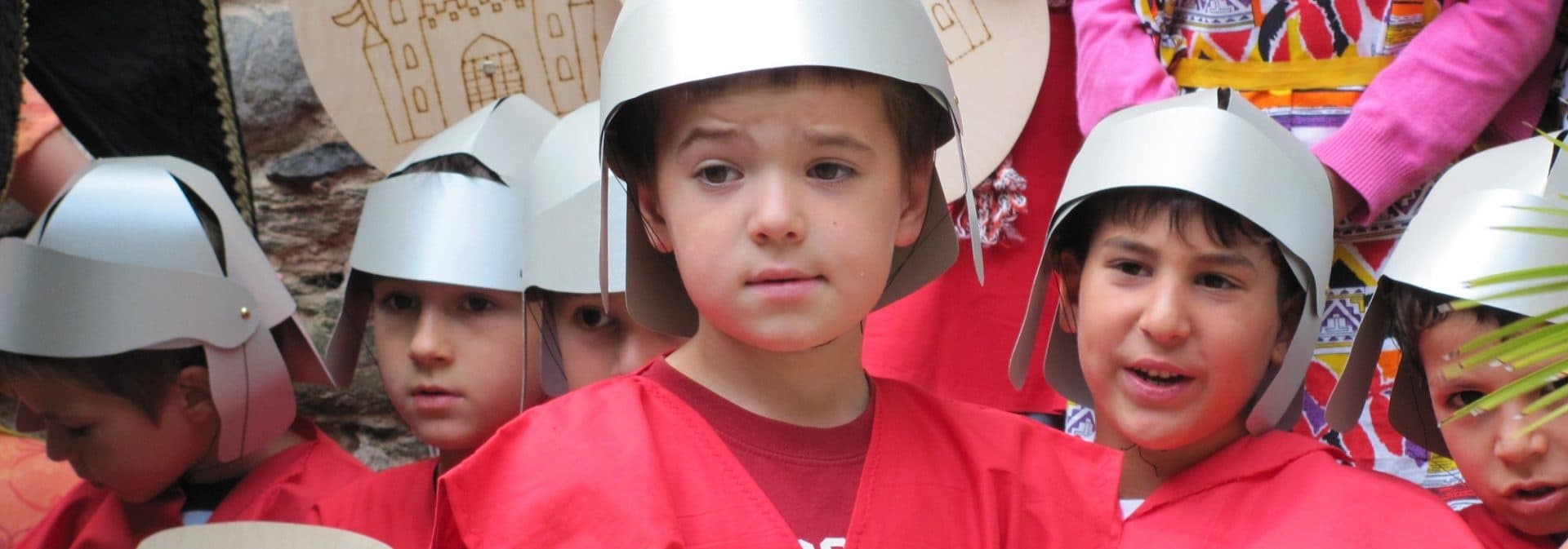 Children wearing helmets during outdoor medieval workshop at Schloss Braunfels