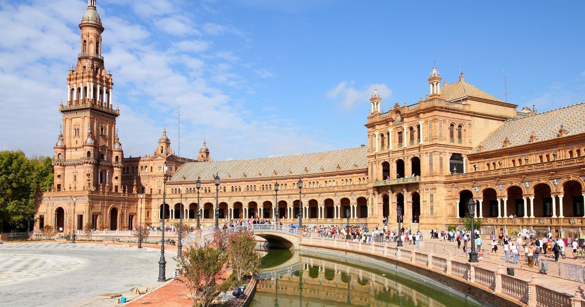 Plaza de España semicircular colonnade with canal in Seville
