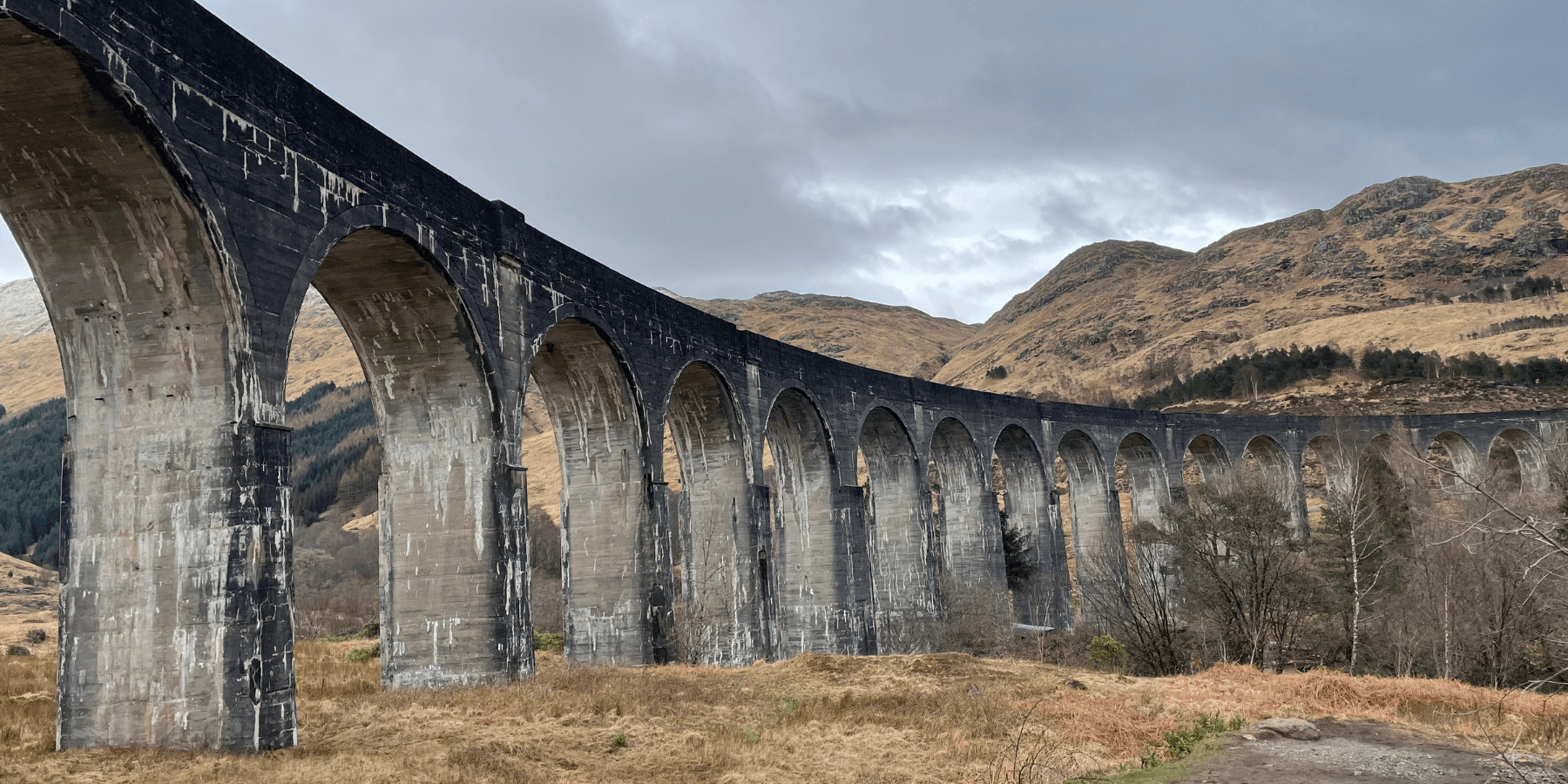Glenfinnan Viaduct spanning Highland moorland, scenic rail landmark