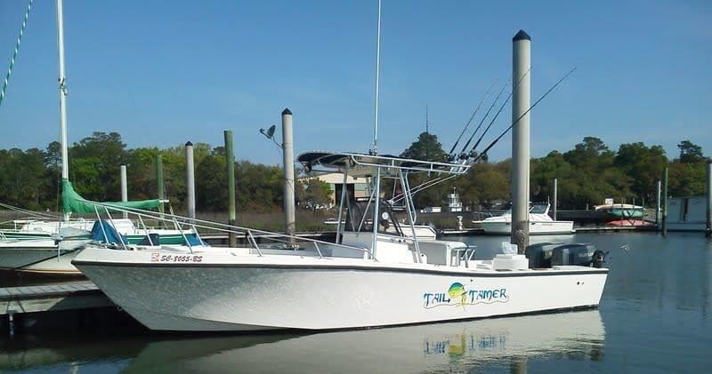 Charter boat moored at marina ready for inshore fishing trips