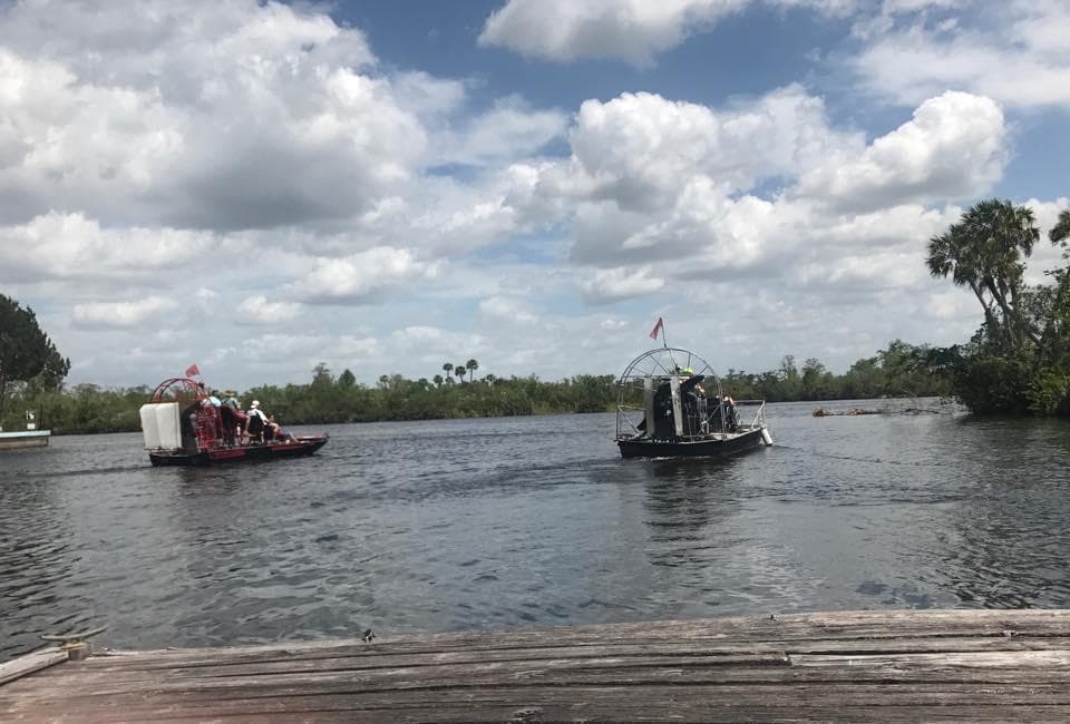 Airboats docked on scenic Florida marsh during tour