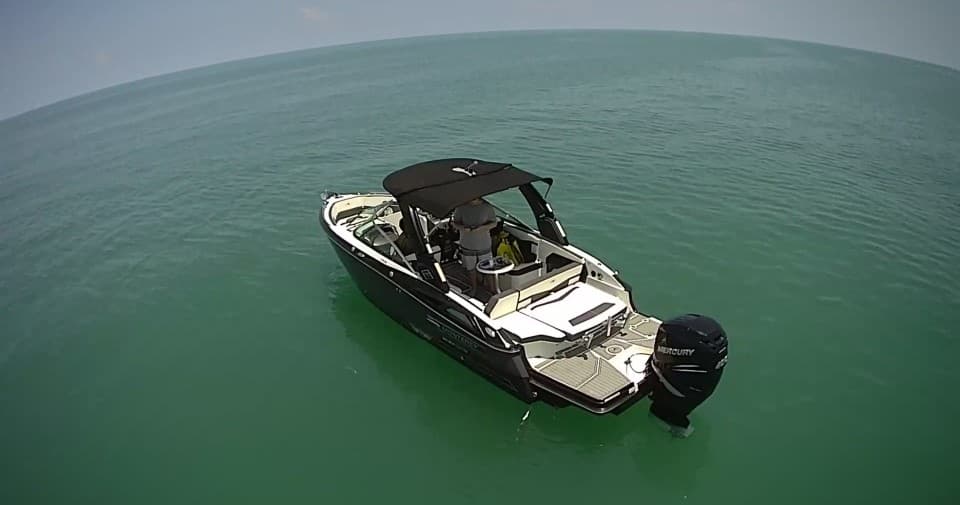 Overhead drone shot of leisure boat in open tropical ocean