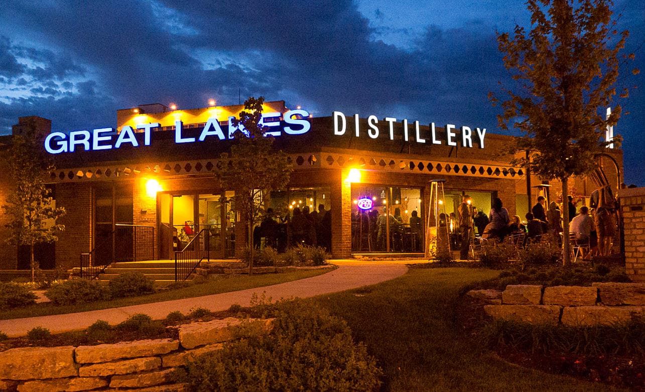 Night exterior of Great Lakes Distillery building and patio