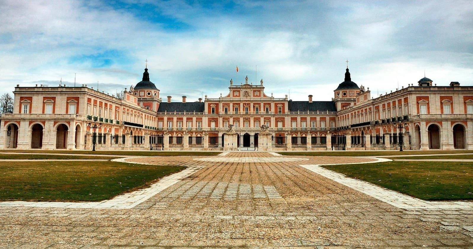 Royal Palace of Aranjuez facade with formal gardens, panoramic view