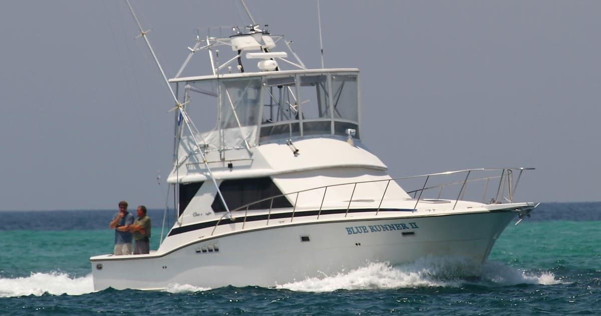 Sportfishing yacht cruising emerald Gulf waters near Destin