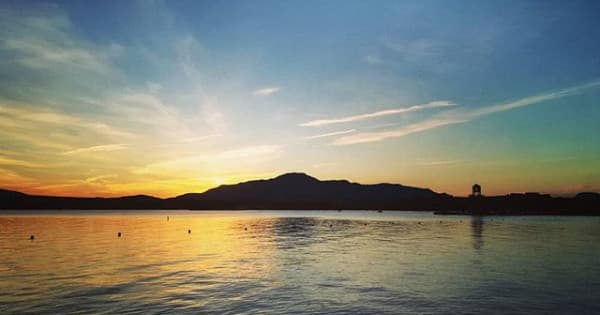Sunset over Lake Memphremagog with silhouetted mountain horizon
