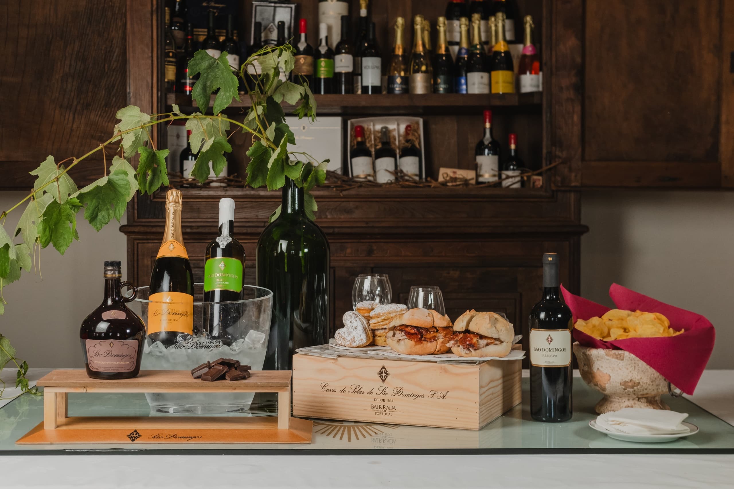 Wine tasting spread with bottles and glasses on rustic table