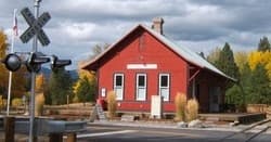 Red historic depot at Sumpter Valley Railroad station in rural Oregon