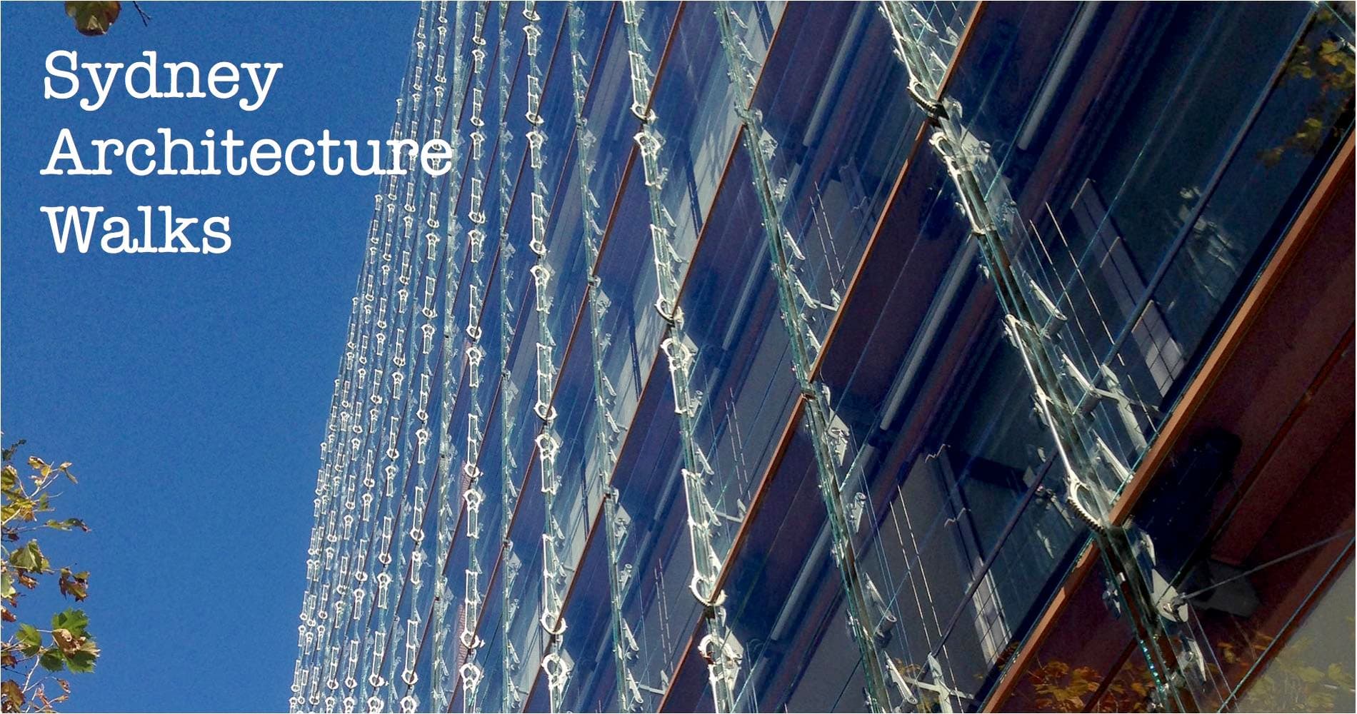 Reflective glass tower with blue sky seen on Sydney architecture walk