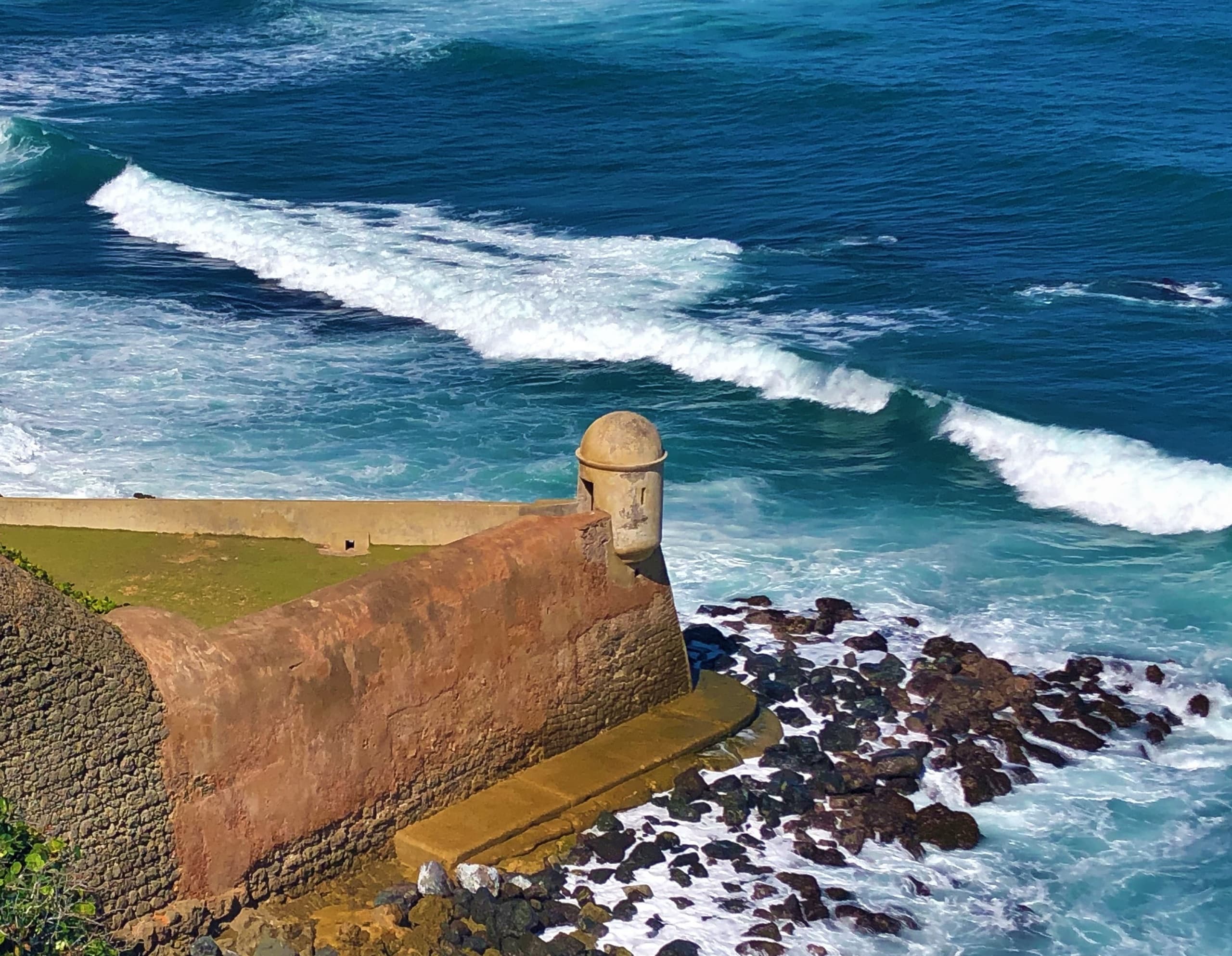Coastal fortress overlooking crashing Atlantic waves in San Juan