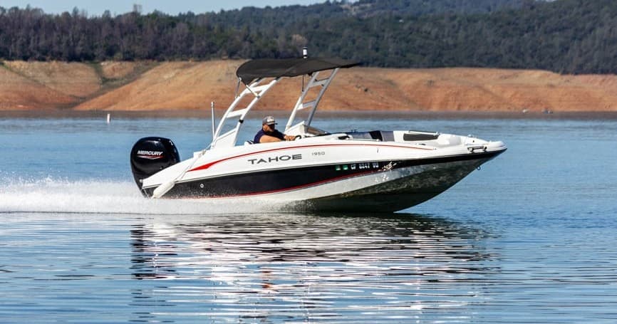 Speedboat slicing through lake water for high-speed boating thrill