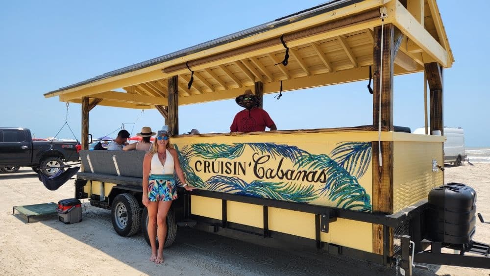 Mobile beach bar trailer serving drinks on sunny shoreline