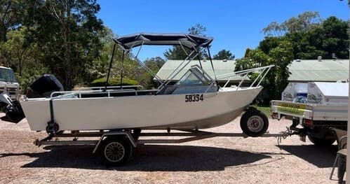 Hire motorboat on trailer at coastal boatyard ready for fishing
