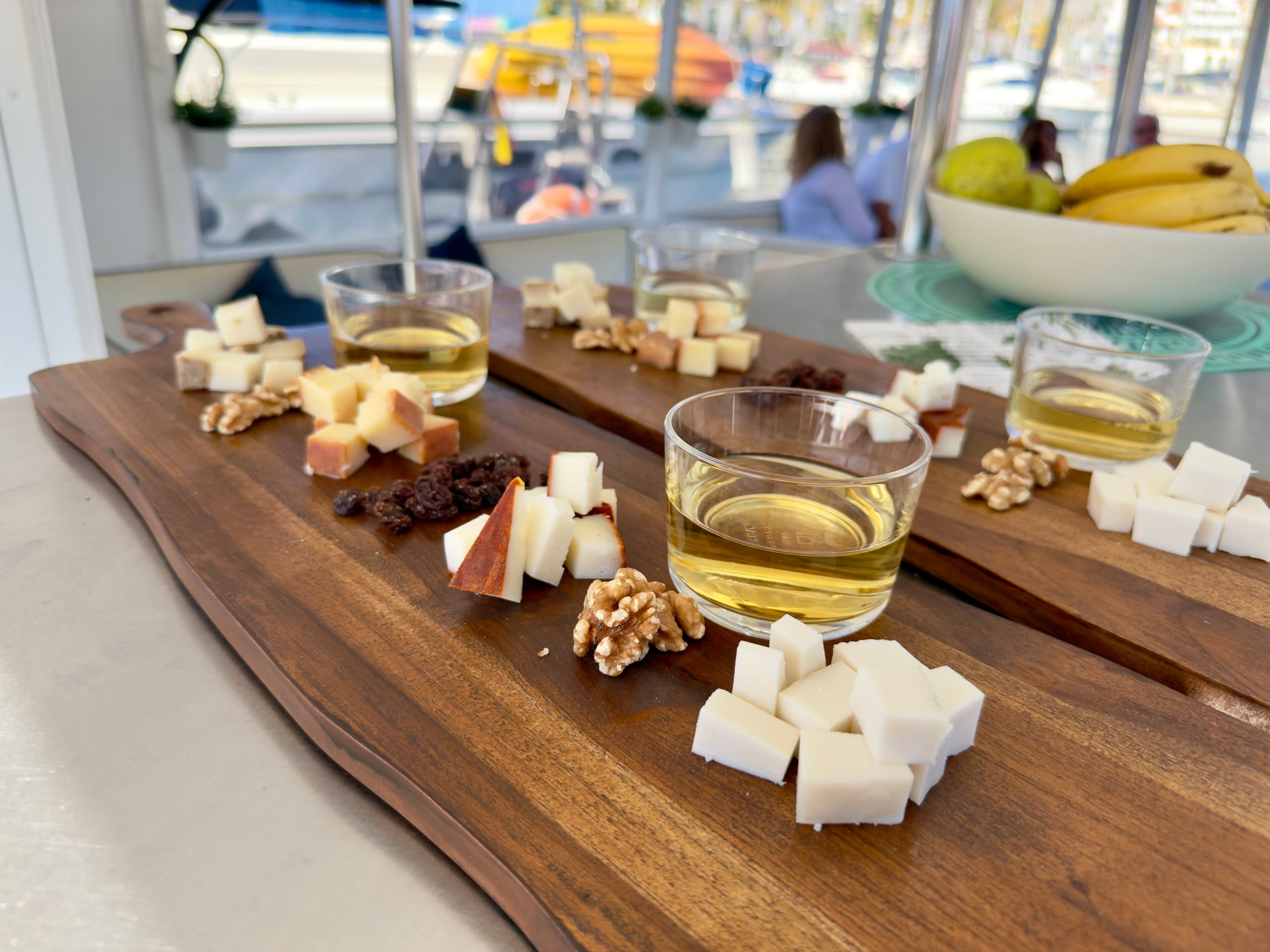 Boat deck cheese and nuts tasting spread during harbor cruise