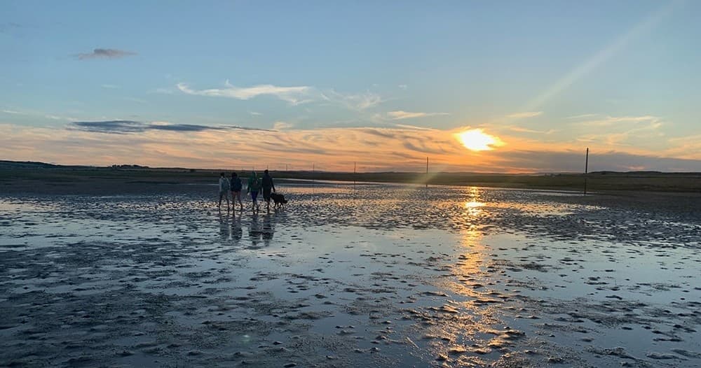 Barefoot Journey Across the Tidal Sands to Holy Island: A Unique Pilgrim Experience in Northumberland