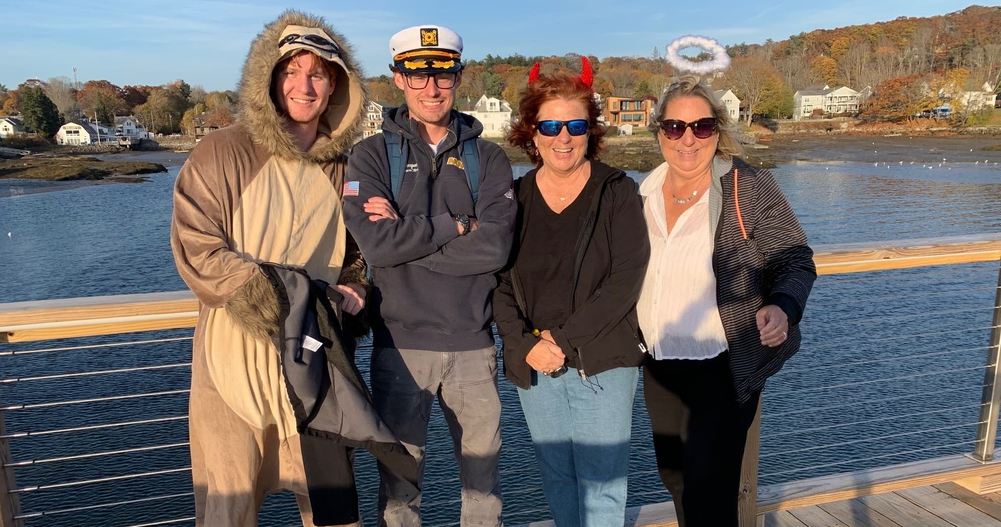 Friends on seaside boardwalk enjoying coastal sightseeing
