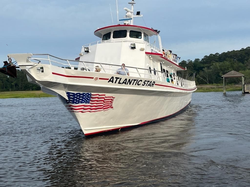 Atlantic Star charter boat cruising a coastal inlet for sea tours