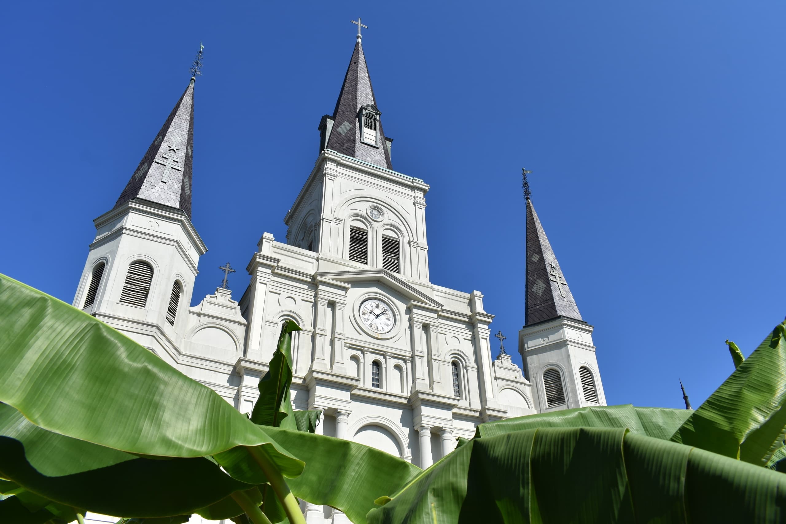 Historic cathedral spires rising against clear blue sky