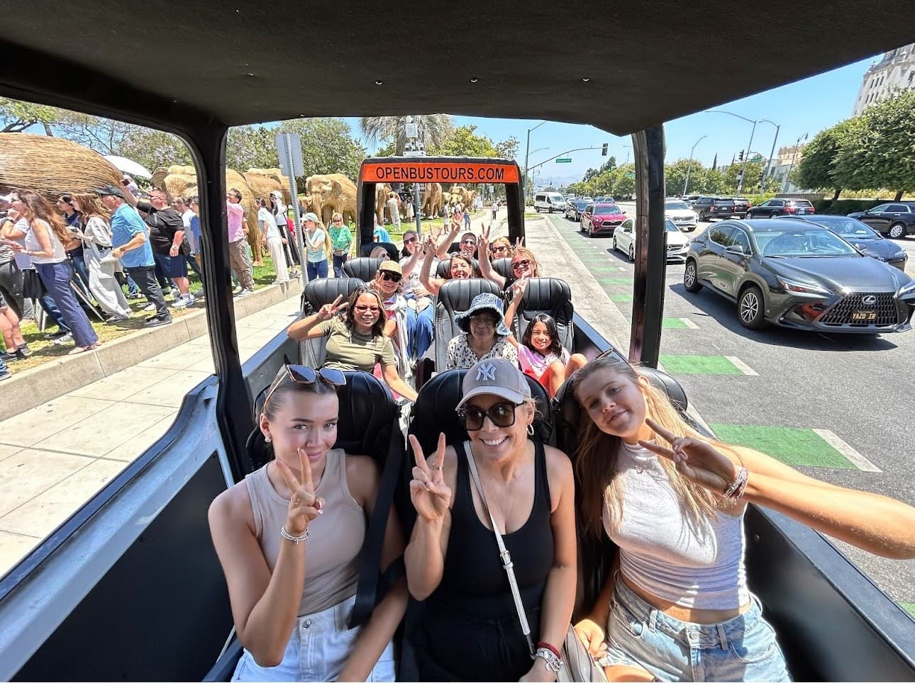 Open-top sightseeing bus passengers enjoying a guided city tour