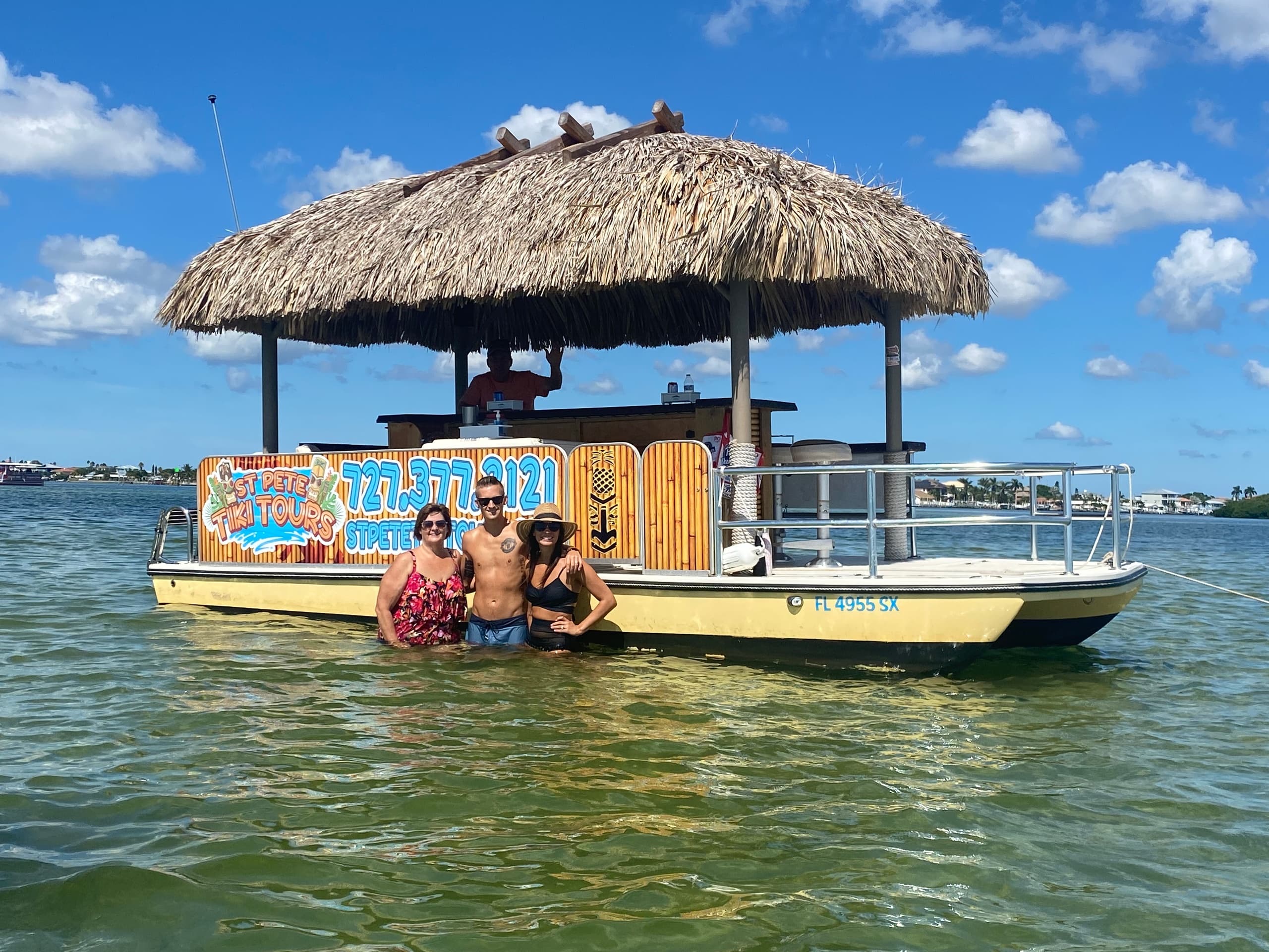 Group enjoying tiki pontoon tour in shallow St. Pete waters