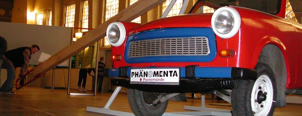 Red vintage car display inside Phaenomenta science museum, Peenemünde