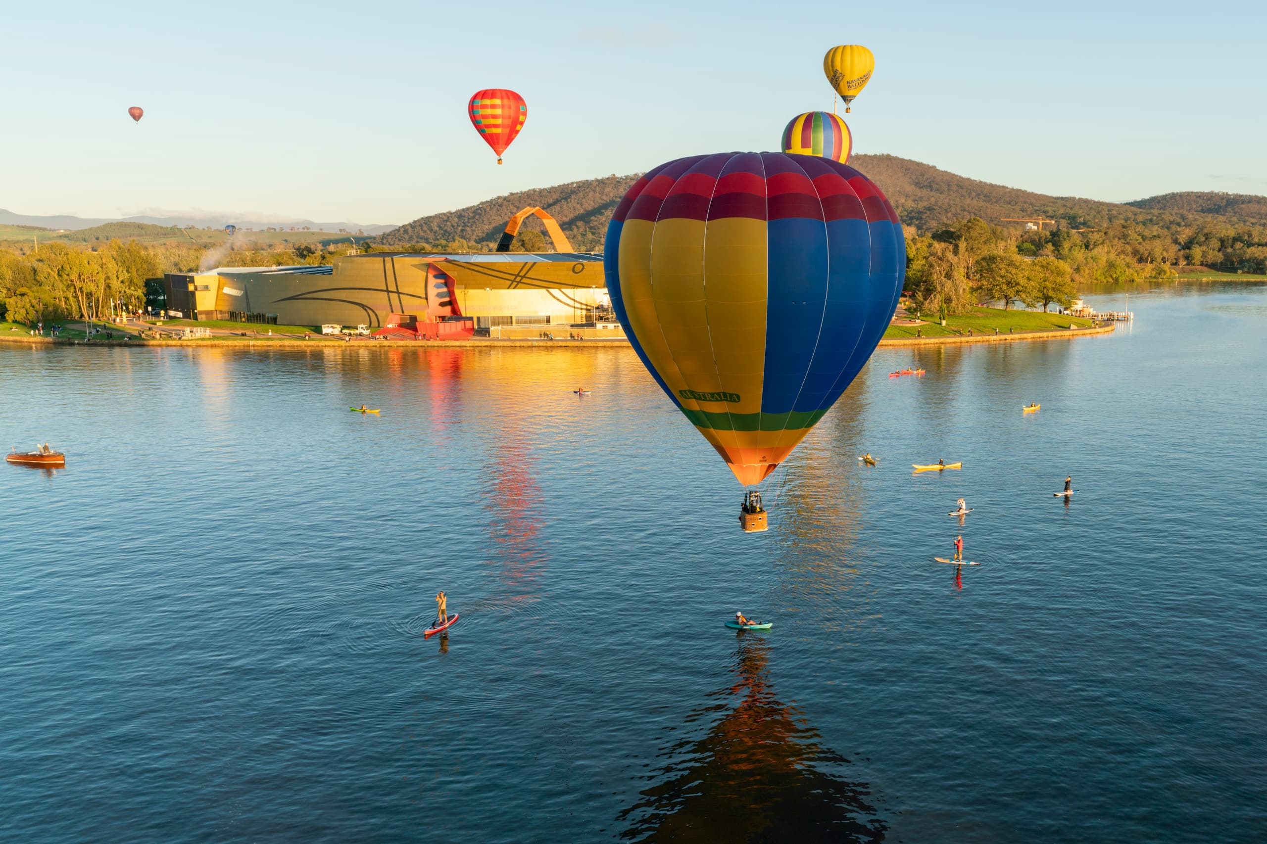 Hot air balloon flight over Lake Burley Griffin, Canberra at sunrise