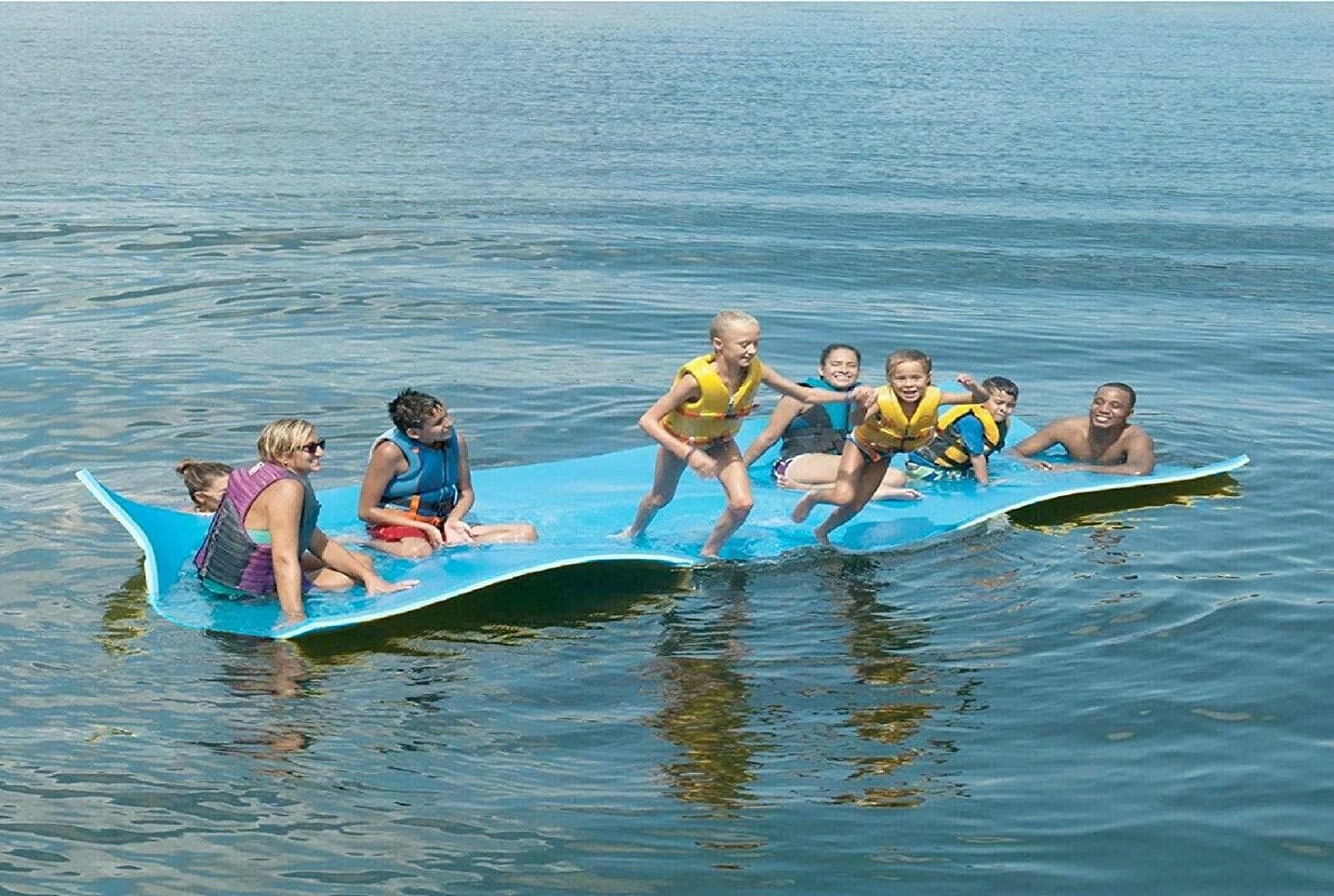Group paddleboarding together on calm coastal bay waters