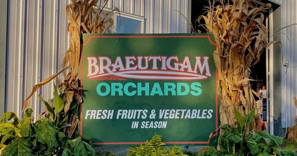 Braeutigam Orchards roadside sign promoting fresh fruits and veggies
