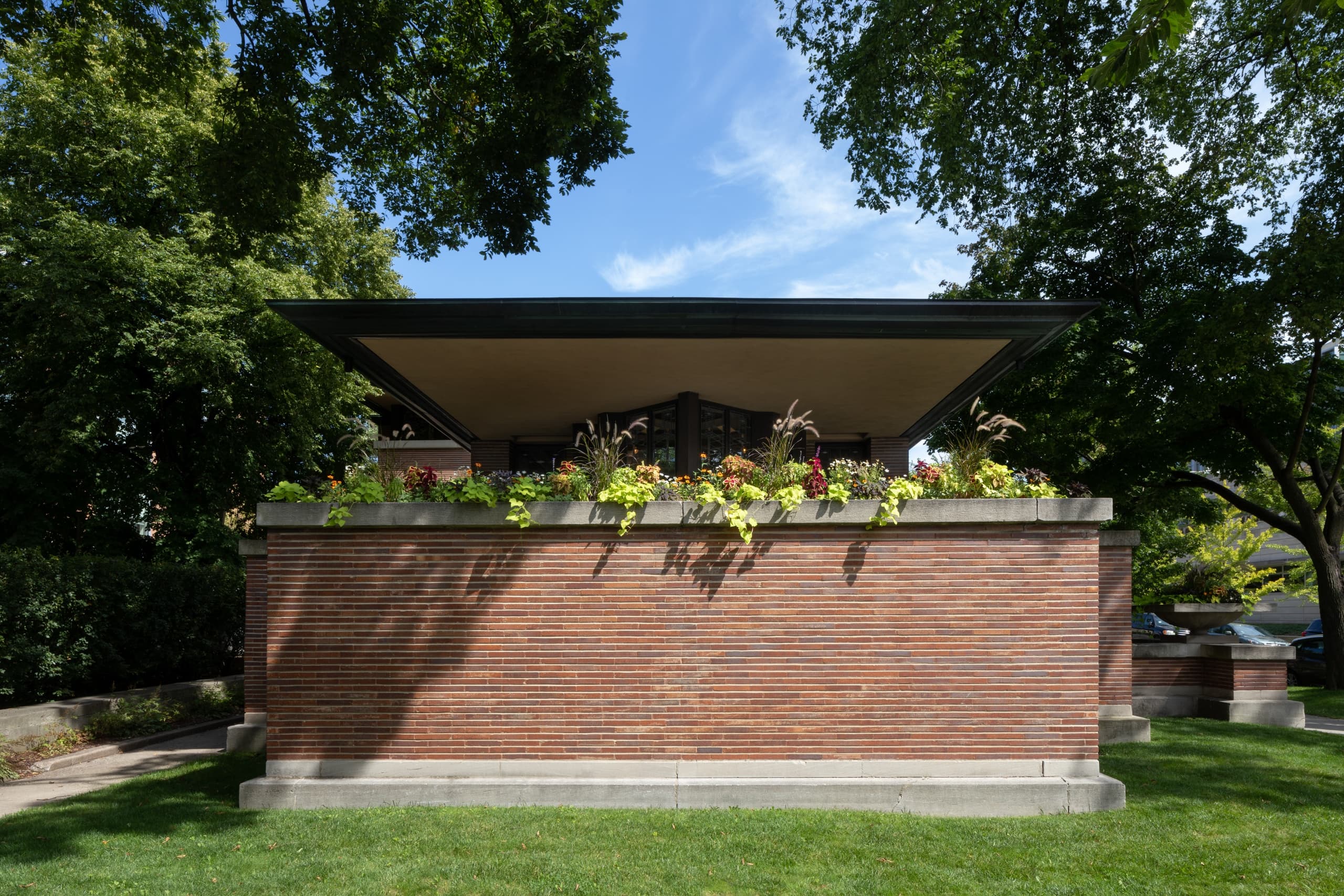 Low-profile modern house exterior on leafy Chicago lawn