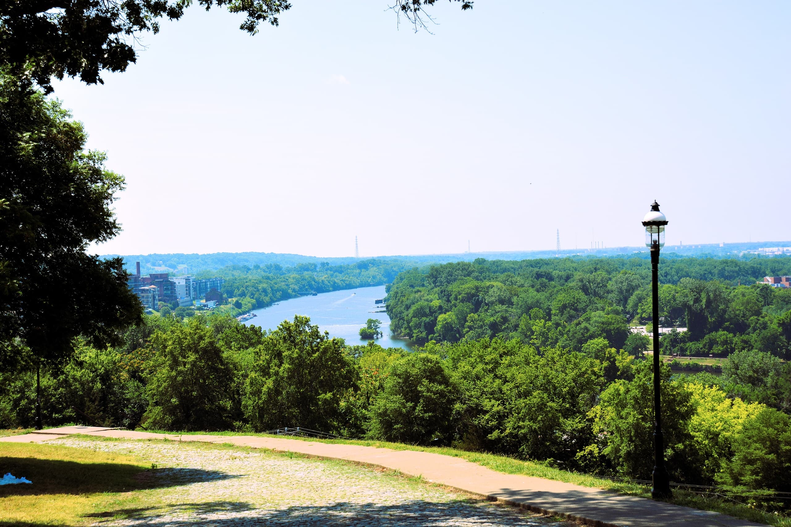 Scenic riverside overlook with forested valley view