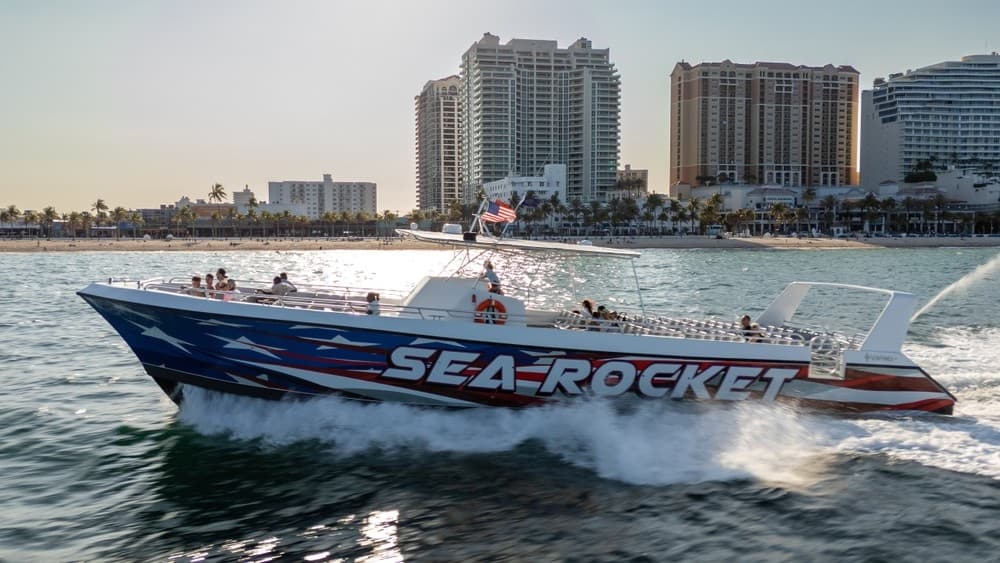 High-speed Sea Rocket powerboat slicing coastal waters near beach