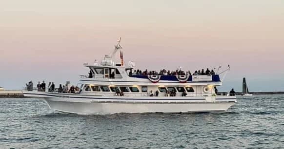 Party cruise yacht with passengers near San Diego harbor