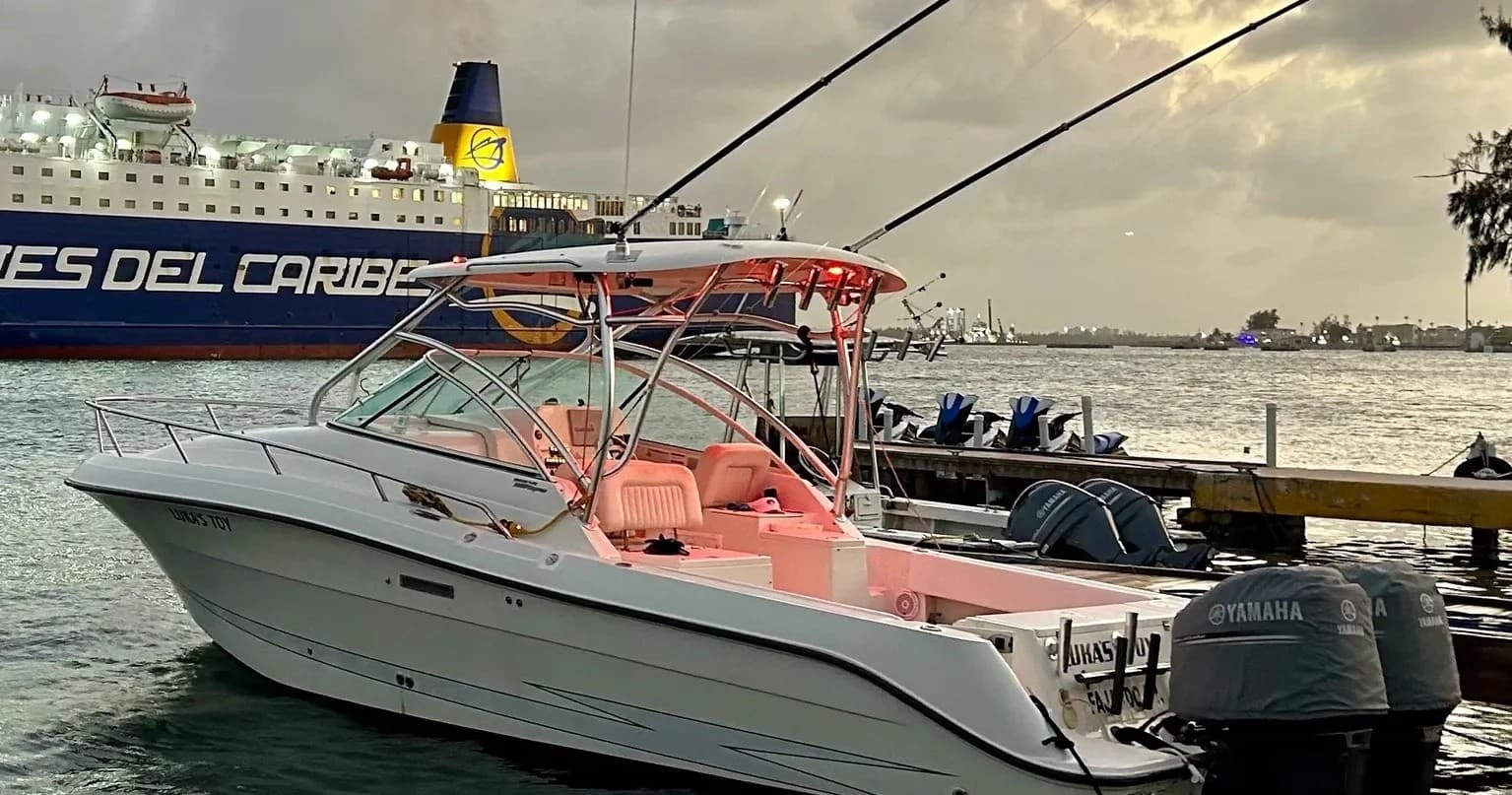 Fishing charter boat moored in San Juan harbor at sunset