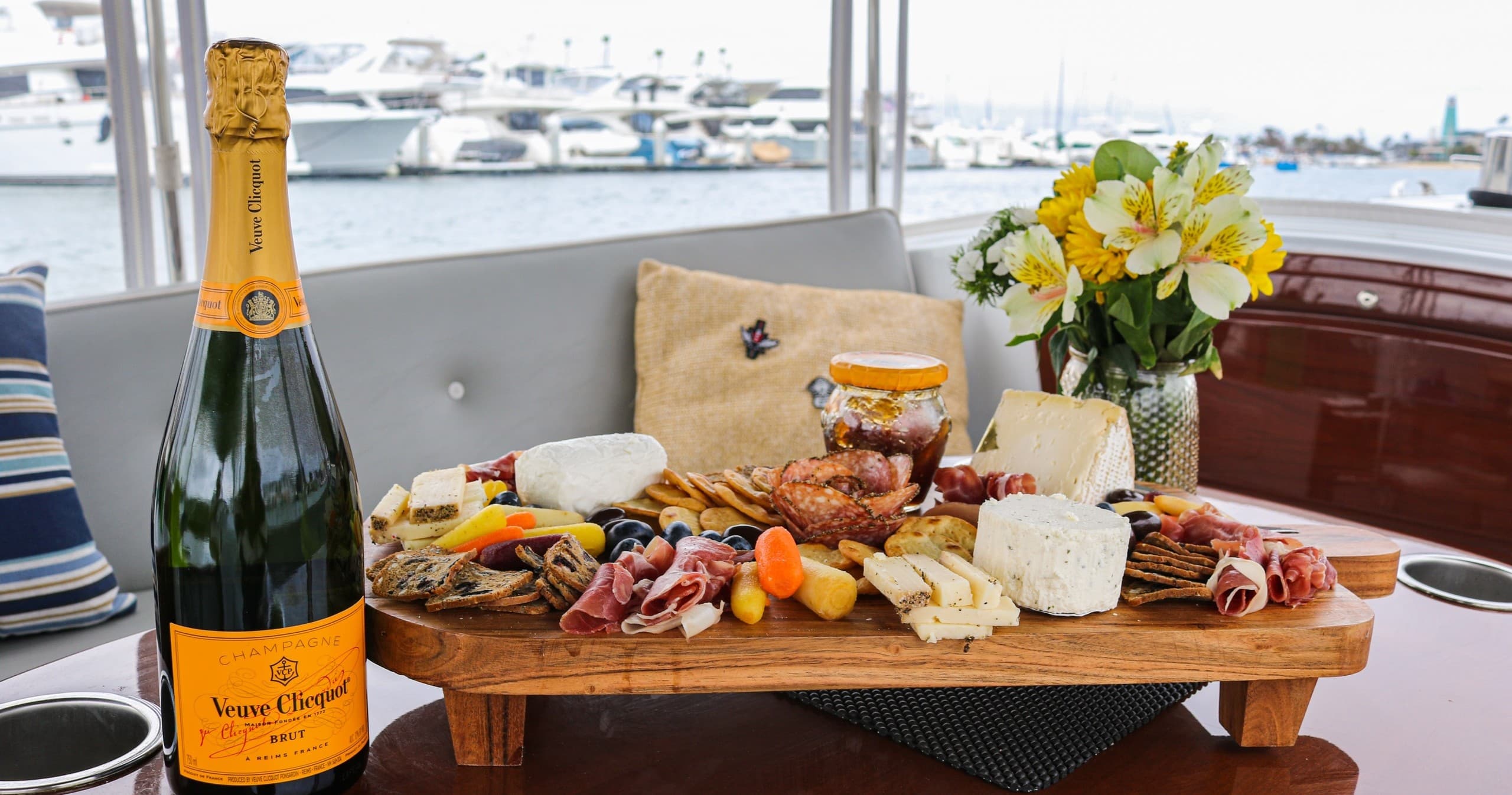 Charcuterie board and champagne served aboard scenic yacht