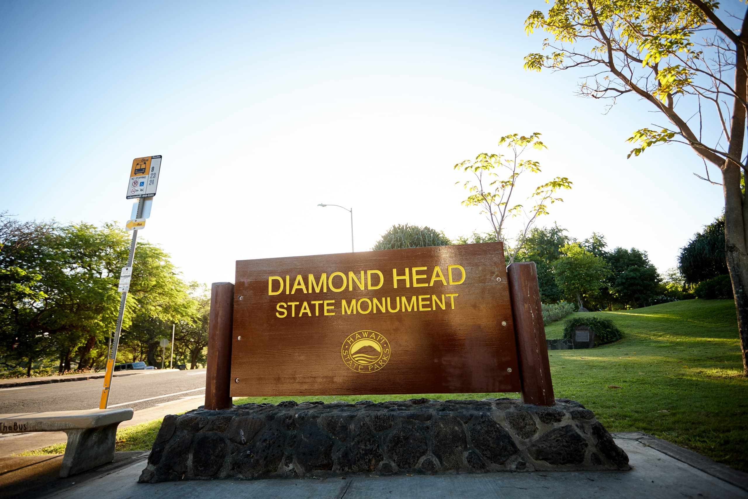 Diamond Head State Monument sign with park lawn and trees