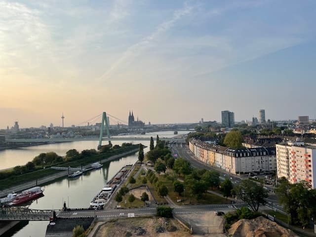 Cologne skyline over Rhine River at sunset for city walking tours