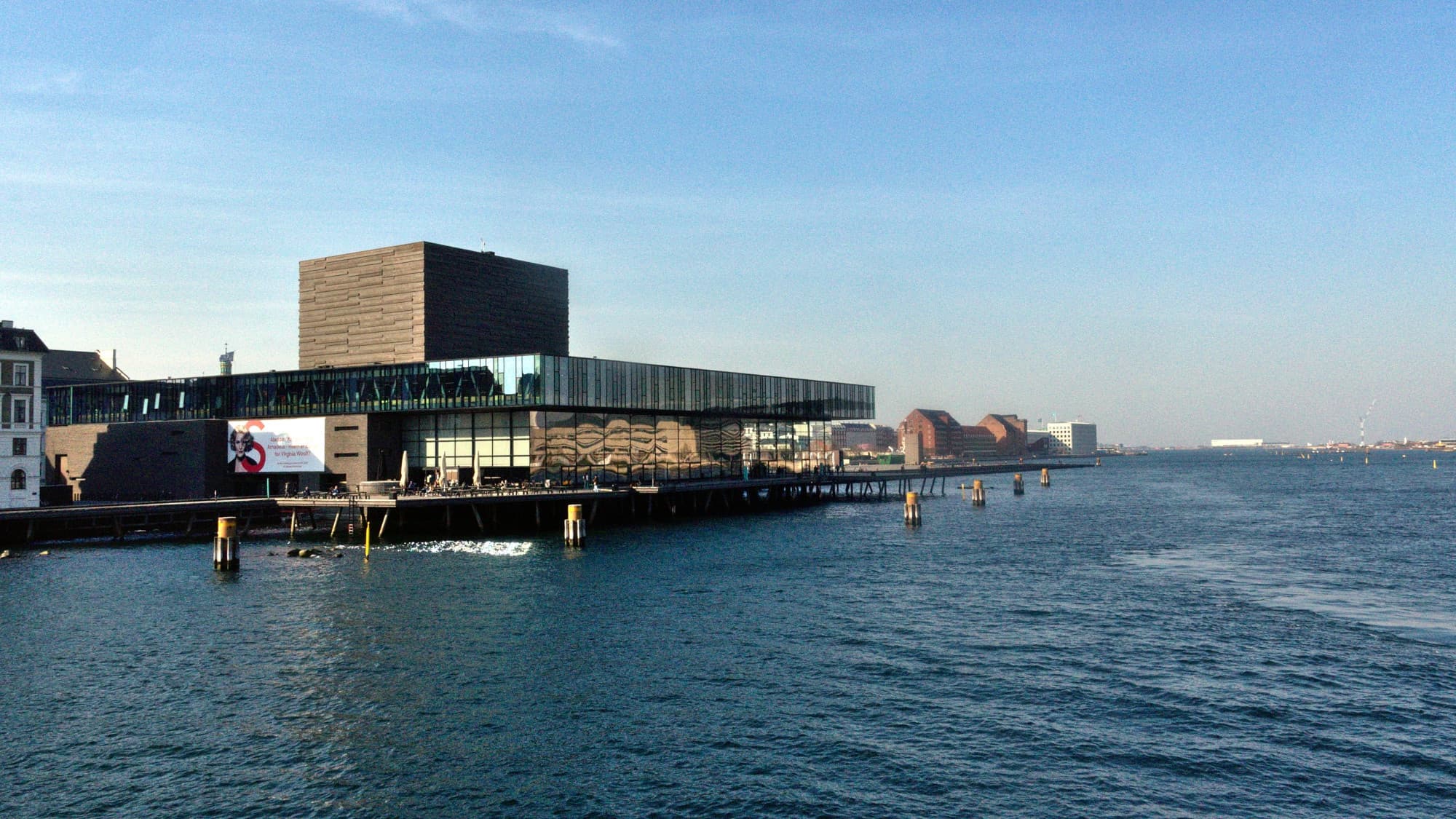 Panoramic Copenhagen harbor scene with waterfront cultural architecture