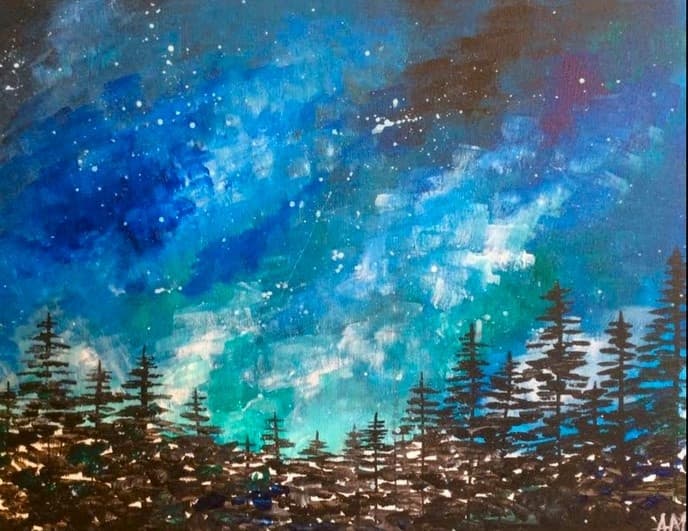 Starry galaxy above silhouetted pine trees and milky way sky