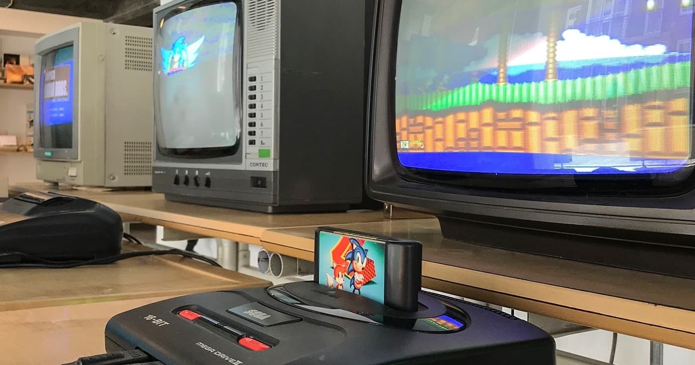 Classic console cartridge and CRT TVs in gaming exhibit