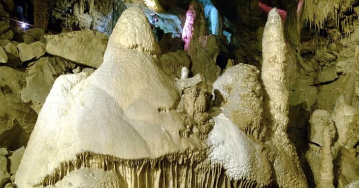 White stalagmite formations in Lost World Caverns cave