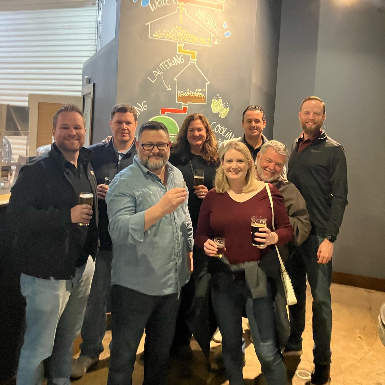 Group sampling craft beers inside a St. Augustine brewery taproom