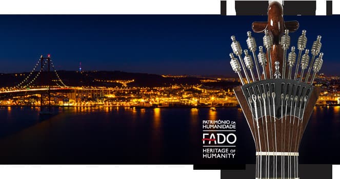 Lisbon waterfront at night with Portuguese guitar for fado show