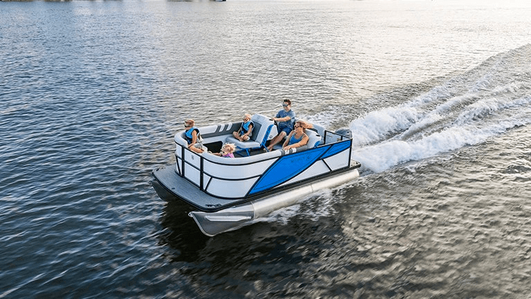 Speedboat cruising across open water creating a dramatic wake