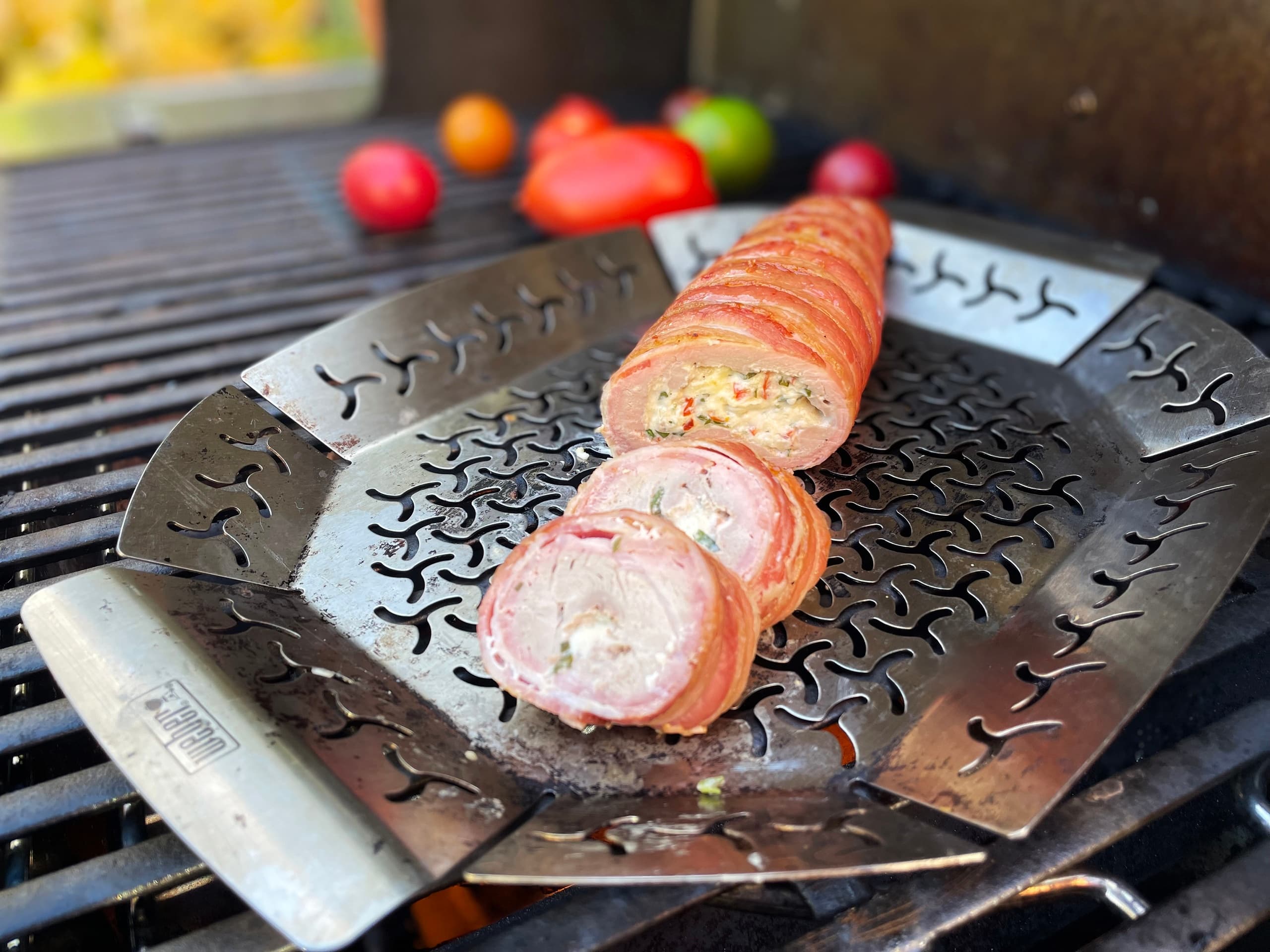 Grill basket with kebabs cooking over charcoal outdoors