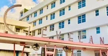Art deco hotel facade and urban courtyard, city street view