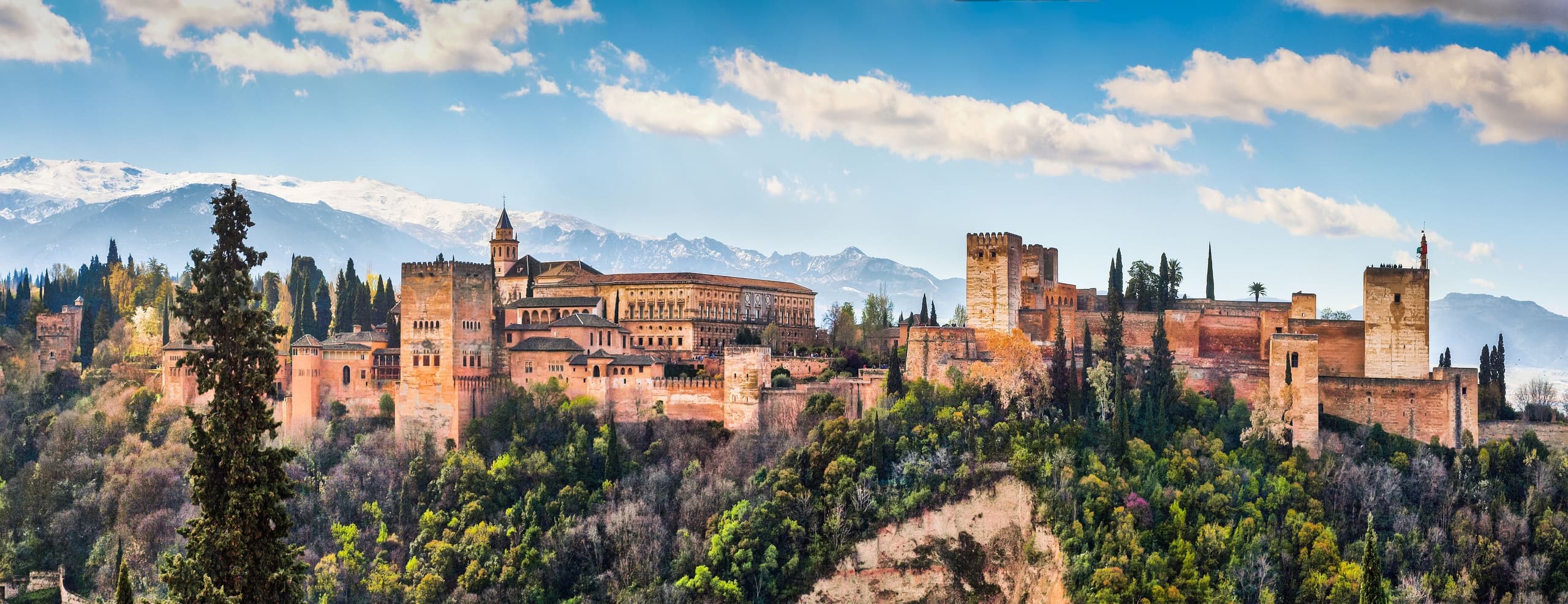 Panoramic view of Alhambra fortress in Granada at sunset
