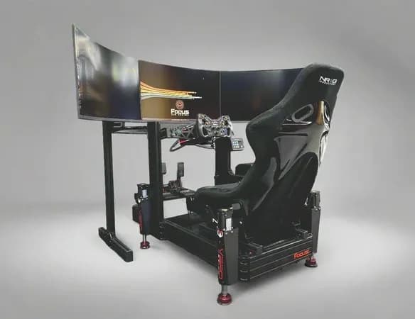 Sim racing cockpit with triple curved monitors in studio