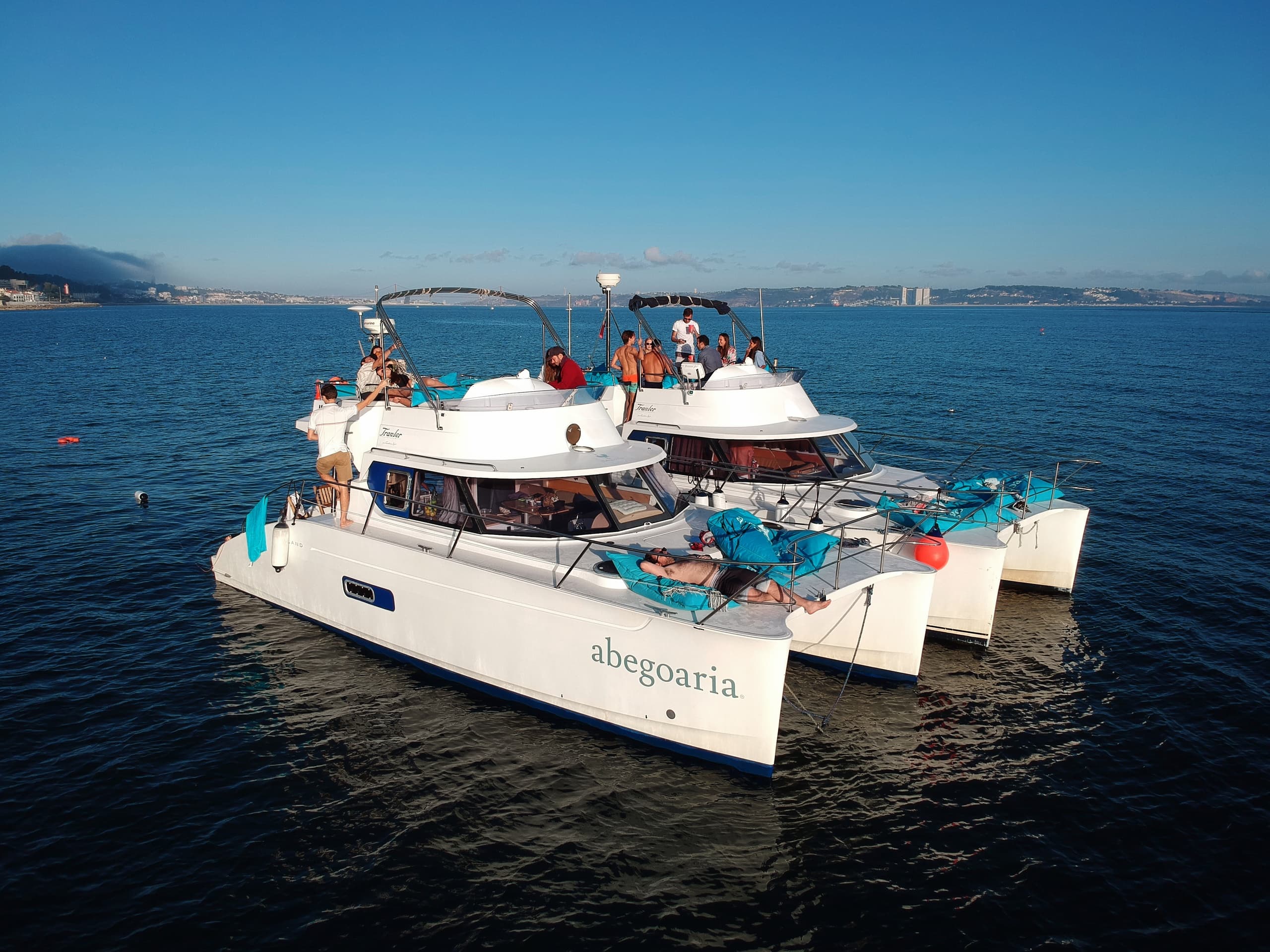 Aerial view of party catamaran sailing Lisbon coastline