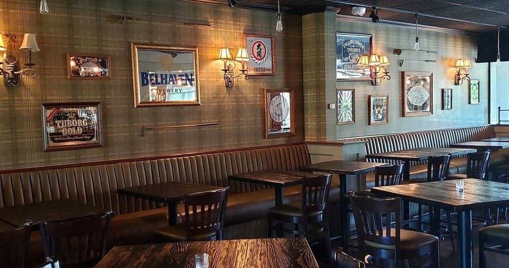 Cozy rustic pub interior with wooden seating and wall decor