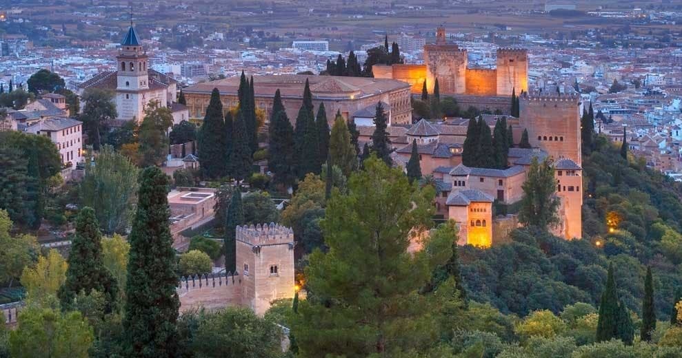 Panoramic Alhambra fortress view over Granada at sunset